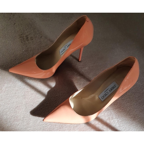 218 - A good and hardly worn pair of Jimmy Choo Shoes. Salmon in colour and size 5 (38).