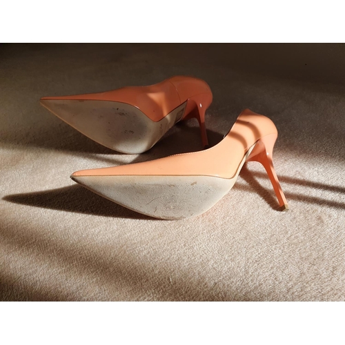 218 - A good and hardly worn pair of Jimmy Choo Shoes. Salmon in colour and size 5 (38).