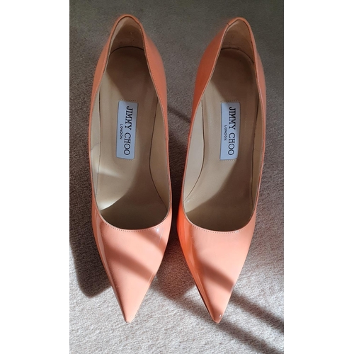 218 - A good and hardly worn pair of Jimmy Choo Shoes. Salmon in colour and size 5 (38).