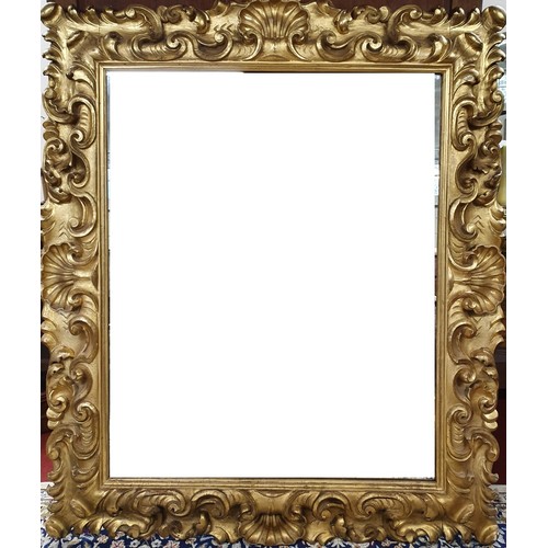 175 - A fabulous Early 19th Century Timber Gilt Wall Mirror with highly hand deep carved outline, water an... 