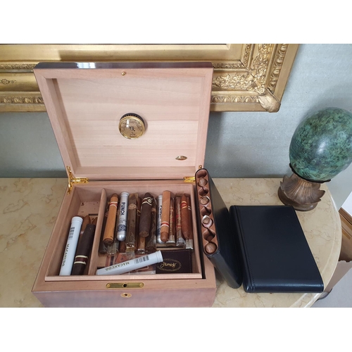 114 - A Mahogany Humidor and contents.