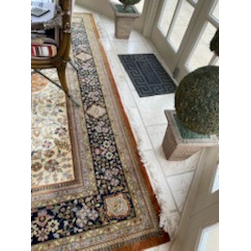 69 - A large Handwoven Kashan Carpet with cream ground multi borders and allover decoration. 380 x 264 cm... 