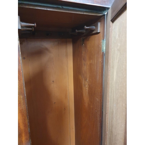 188 - A Victorian Mahogany three door Wardrobe with fitted centre. In need of some restoration. 185 x52.5 ... 