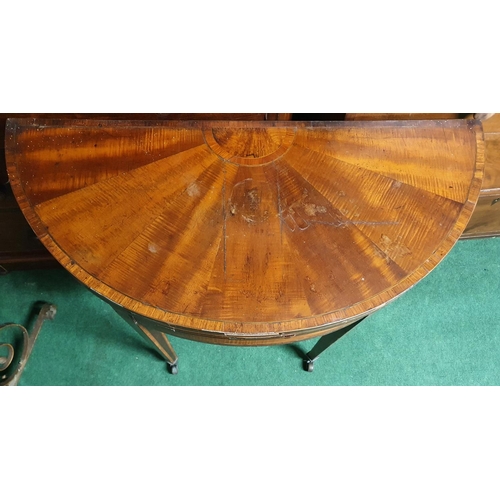 78 - A 19th Century Mahogany and Veneered half moon fold over Card Table, the top is veneered in a sunbur... 