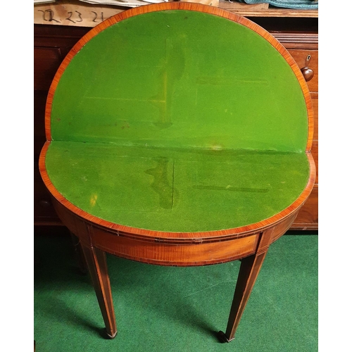 78 - A 19th Century Mahogany and Veneered half moon fold over Card Table, the top is veneered in a sunbur... 