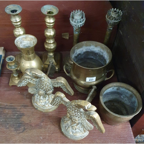 257 - A good quantity of 19th Century brass Candlesticks, along with other items.