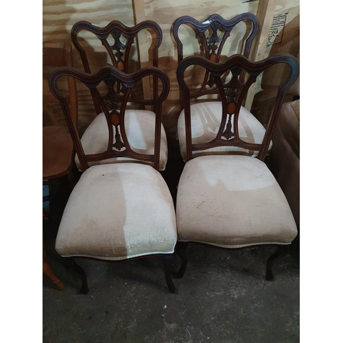 852 - A set of four Edwardian Mahogany and Inlaid Chairs.