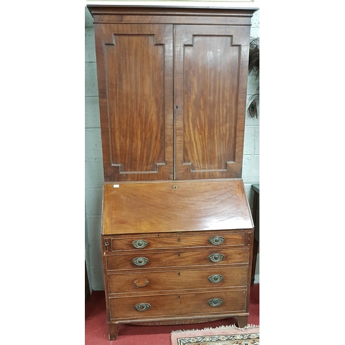 822a - A Georgian Mahogany Bureau Bookcase with a blind panelled top. W 96 X D 56 X H 210 cms approx.