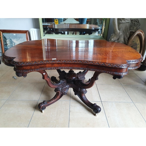 114 - A superb 19th Century Walnut Centre Table with a highly carved pod, frieze and a concave carved top.... 