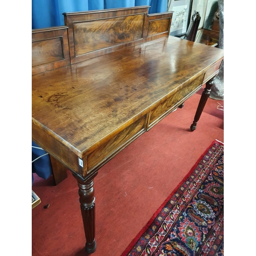 81 - A Victorian Mahogany Serving Table with turned supports, single frieze drawer and gallery back. W 17... 