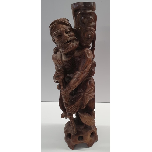 105a - A large Oriental Hardwood carved Figure of an Elderly Man. H59 cms approx.