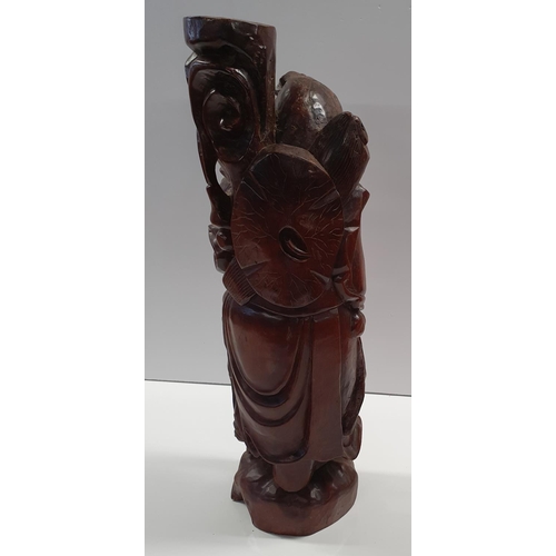 105a - A large Oriental Hardwood carved Figure of an Elderly Man. H59 cms approx.