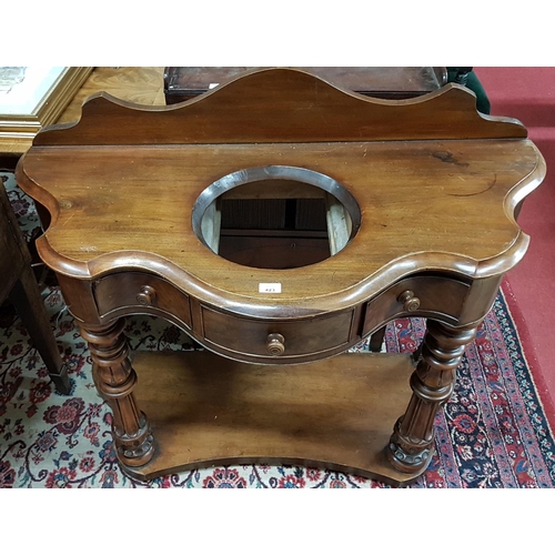 121 - A good 19th Century Serpentine fronted Washstand with turned and fluted supports on a platform base.... 