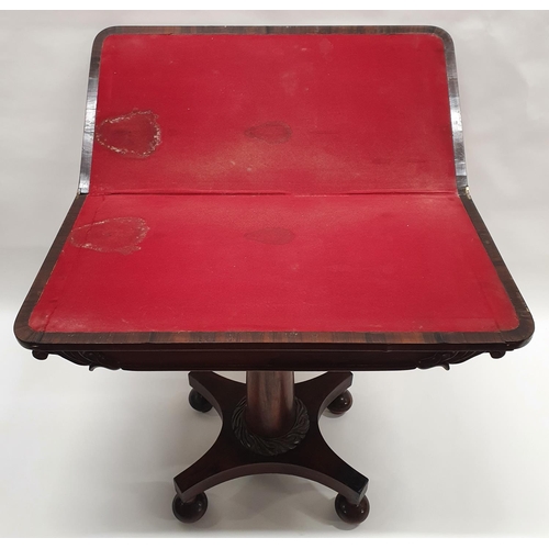 153 - An early 19th Century rosewood fold over Card Table with a carved circular centre shafted platform P... 