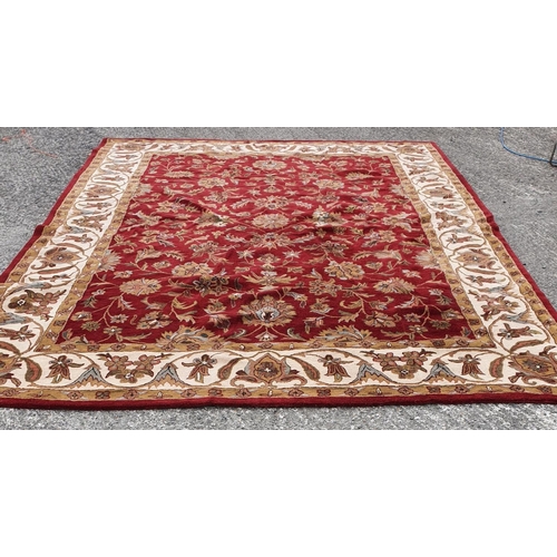 479 - A large deep pile red/burgundy ground Oriental Carpet with multi borders and all over decoration. 30... 