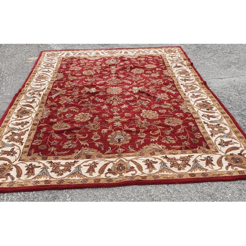 479 - A large deep pile red/burgundy ground Oriental Carpet with multi borders and all over decoration. 30... 