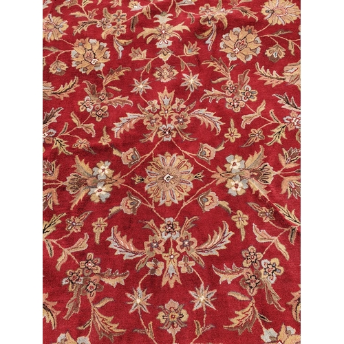 479 - A large deep pile red/burgundy ground Oriental Carpet with multi borders and all over decoration. 30... 