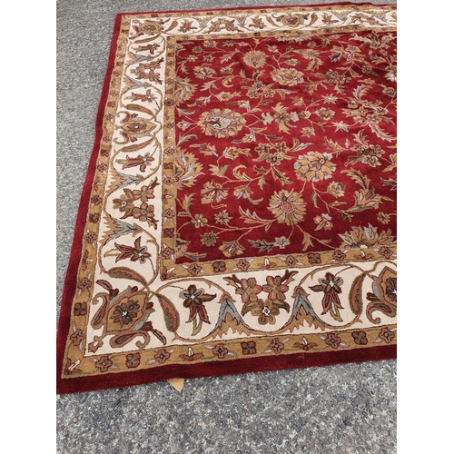 479 - A large deep pile red/burgundy ground Oriental Carpet with multi borders and all over decoration. 30... 