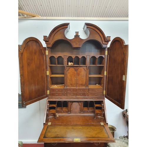 497 - A good Walnut two door Bureau Bookcase with bureau base and turn blind upper section with architectu... 