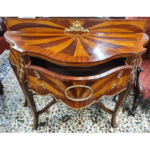 206 - A Late 19th Century Mahogany Inlaid serpentine fronted Side Table with sunburst effect top and ormol... 