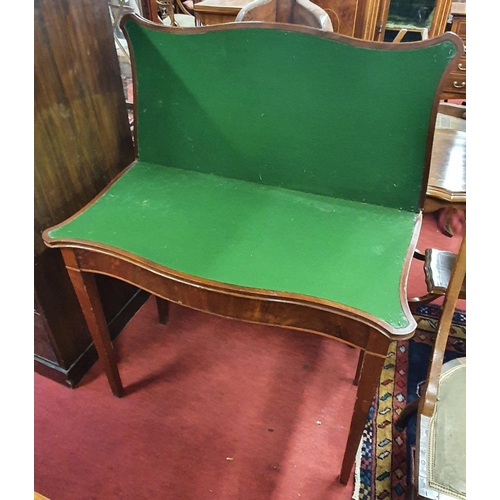 168 - Of superb quality, A Regency Mahogany Serpentine fronted Foldover Card Table on square tapered suppo... 