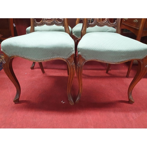 260 - A good set of 19th Century Walnut pierced back Dining Chairs with cabriole front supports.