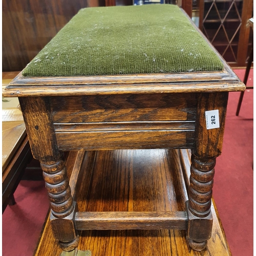 262 - An early 20th Century Piano Stool with upholstered top. 57 x 35 x H 42 cms approx.