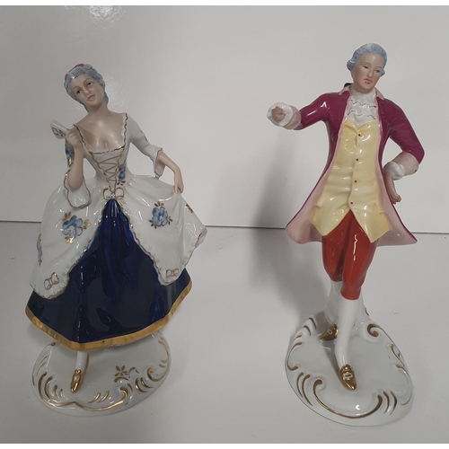 76 - A pair of Royal Dux Porcelain figures. H 21 cms approx.