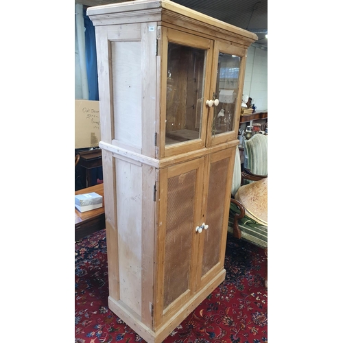 561 - A 19th Century stripped pine Food Cupboard with brass grill lower doors and glazed upper. W 82 x D 5... 