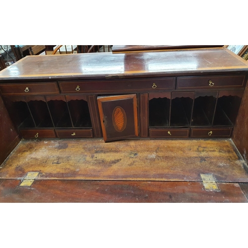 669 - A Period Sheraton Mahogany Bureau, crossbanded and inlaid with fitted interior. W 97.5 x D 52 x H 10... 