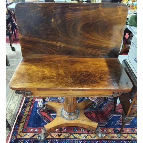 258 - Of superb quality. A Regency Rosewood Foldover Tea Table on a highly carved platform base. 91 x 91 x... 