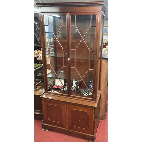 264 - A Mahogany Inlaid two door glazed Bookcase with blind bottom doors. W 91 x D 47 x H 199 cms approx.