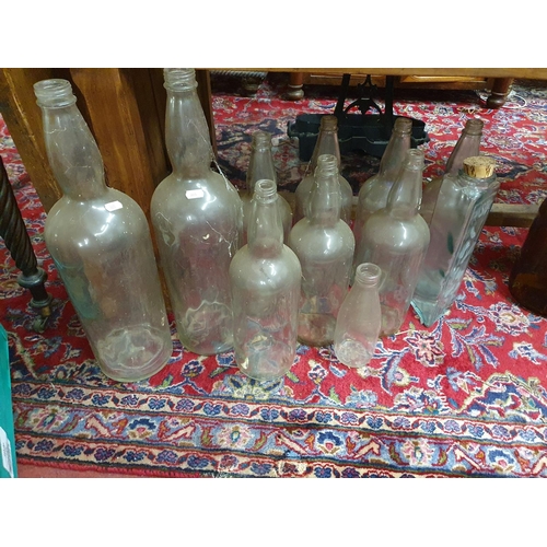 662 - A good quantity of Demijohns along with a quantity of Vintage Glass Bottles.