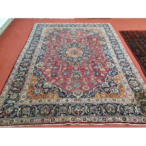 1039 - A large Vintage multi coloured Iranian Carpet from the Marshad region with a floral medallion design... 