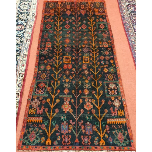 1040 - A Persian runner. 257x 125 cms approx.