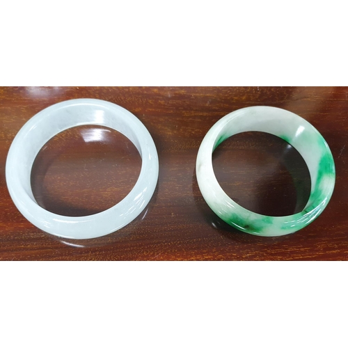 515 - Two Jade Bangles.