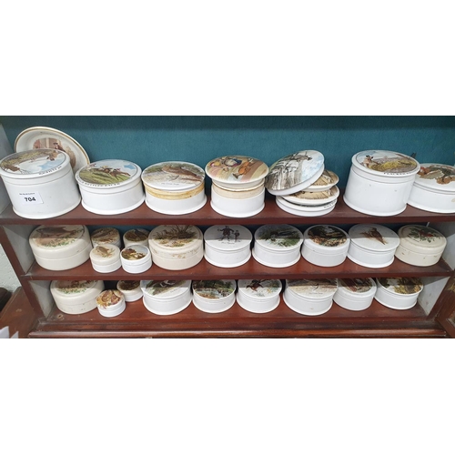 704 - A large quantity of Prattware style Pots.