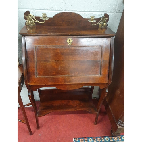 712 - An Arts and Crafts Mahogany narrow Bureau with full flap and Brass Candle Holders. 70 x 37 x 110H cm... 