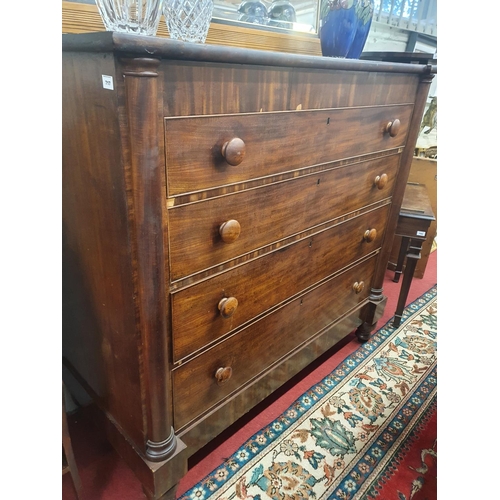 717 - A substantial 19th Century Mahogany bedroom Chest of four long graduated drawers flanked by split co... 