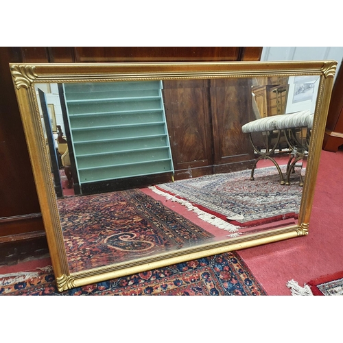 764 - A Gilt bevelled edge Mirror. 94 x 63 cms approx.