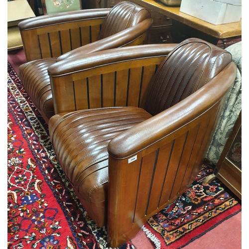 798 - A Fantastic pair of Brown Leather Club Chairs in the Art Deco style with a ribbed upholstered outlin... 