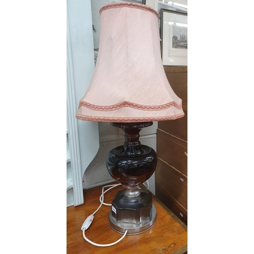 808 - A good ebonized and silvered Table Lamp. H 83 cms approx.