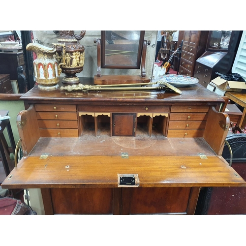 829 - An early 19th Century Mahogany Secretaire with original glass knobs. 120 x D 58 x H 122 cms approx.