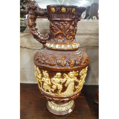 835 - A very large terracotta Vase with relief moulded exterior. H 42 cms approx.