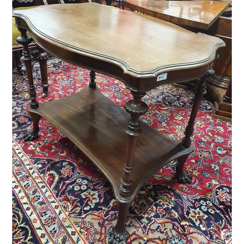 843 - A late 19th Century Mahogany Irish two tier Table with serpentine edge. 90 x 55 x H 75 cms approx.