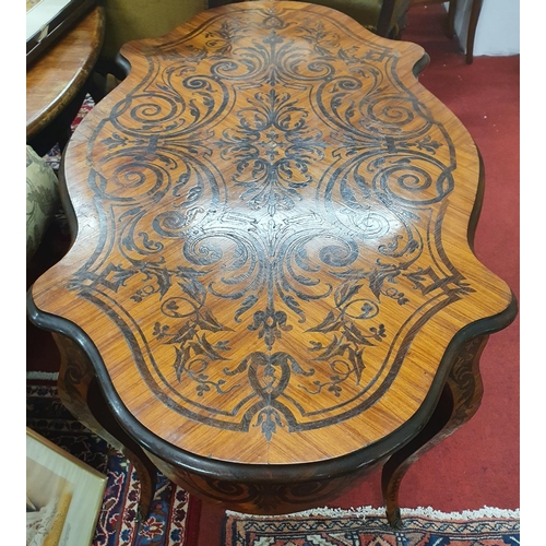 845 - A good Satinwood and Coromandel centre Table with swept supports and Ormolu mounts. 120 x 70 x H 74 ... 