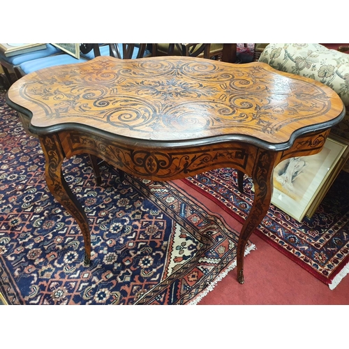 845 - A good Satinwood and Coromandel centre Table with swept supports and Ormolu mounts. 120 x 70 x H 74 ... 