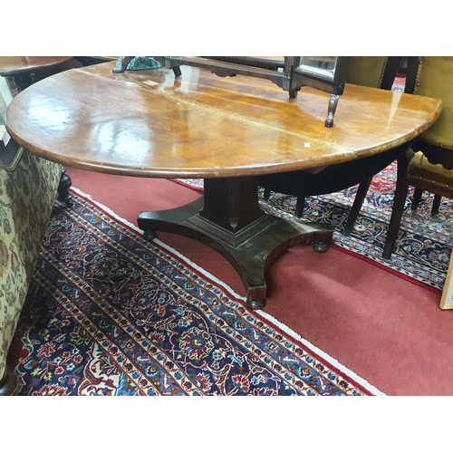 850a - A good early 19th Century Mahogany Dropleaf Dining Table on a pedestal base. Circular when up. 140 x... 