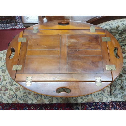 851 - A good Yew wood snap top Butlers Tray on stand. 70 x 67 x H 57 cms approx.