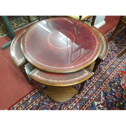 877 - A lovely 20th Century Mahogany Nest of Tables. The larger circular Table supporting four quadrant si... 